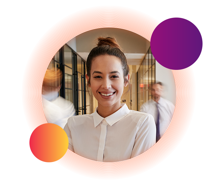A woman wearing a white button-up shirt with her hair in a bun smiles toward the camera. This image is slightly overlapped by a small purple circle in the top-right and a small orange circle in the bottom-left.
